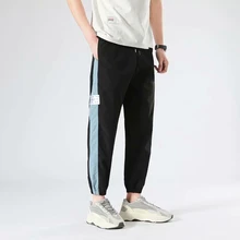 

Men Loose Ankle Length Pants Spring Autumn Striped Style with Pockets Sports Pants Men High Waist Lace-up Streetwear Harem Pants