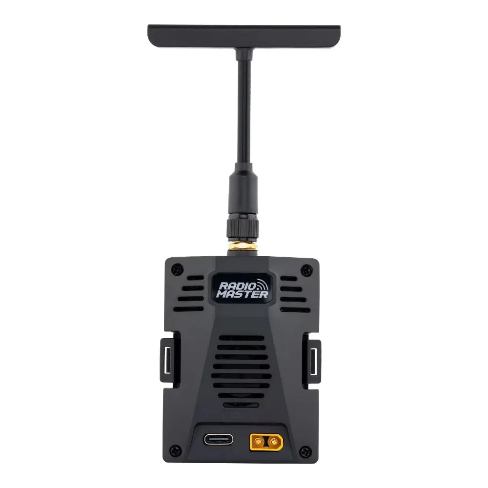 Gros plan sur le module ELRS Ranger Micro 2.4 GHz RadioMaster avec son antenne dépliée, symbole de portée étendue.