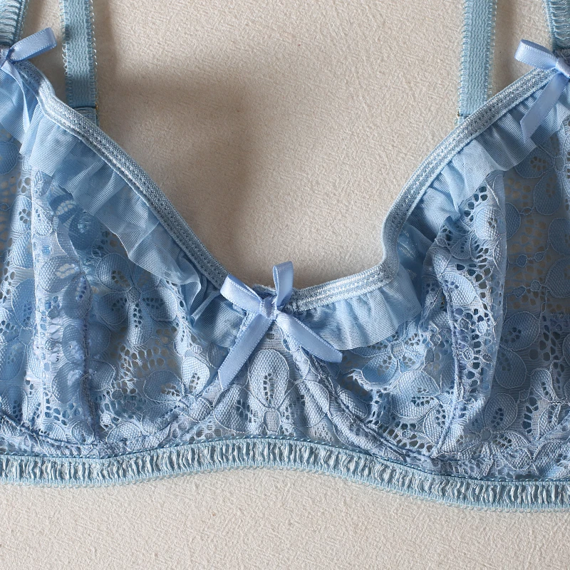 Adjustable strap detail with soft blue trim and feminine bow finish