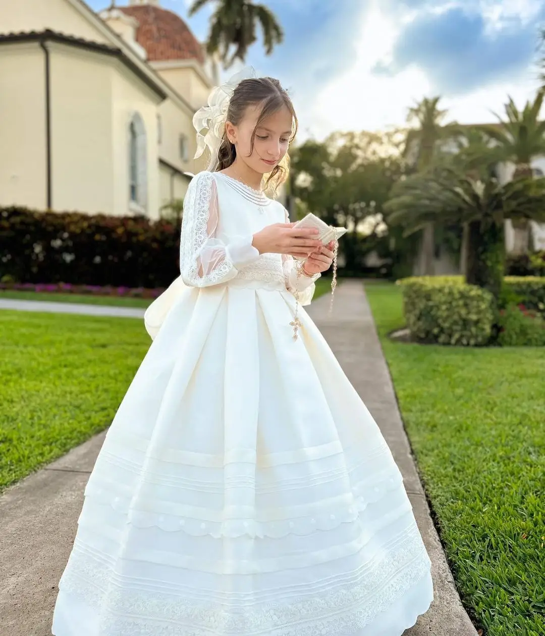 FATAPAESE First Communion Dress Made with Satin Fabric Long Sleeves with Vintage-like Laces Bow and Covered Buttons for Closure