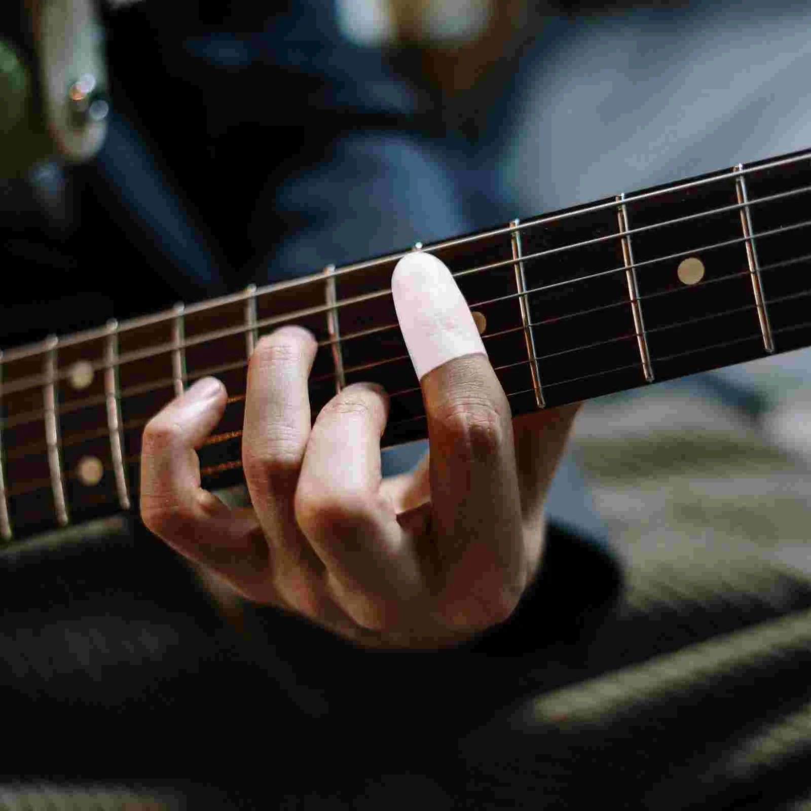 

4pcs Silicone Finger Cots Fingertips Protection Caps Fingertip Protectors for Ukulele Guitar Practice