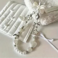 Lanière à breloques en chaîne de téléphone perlée pour iPhone Samsung, joli nœud blanc baroque, breloque en forme de fleur, accessoires universels, pendentif de bijoux 2