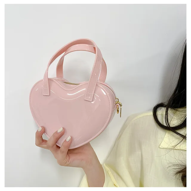 Small heart shaped handbag with detachable crossbody strap – The Out Of  Reach