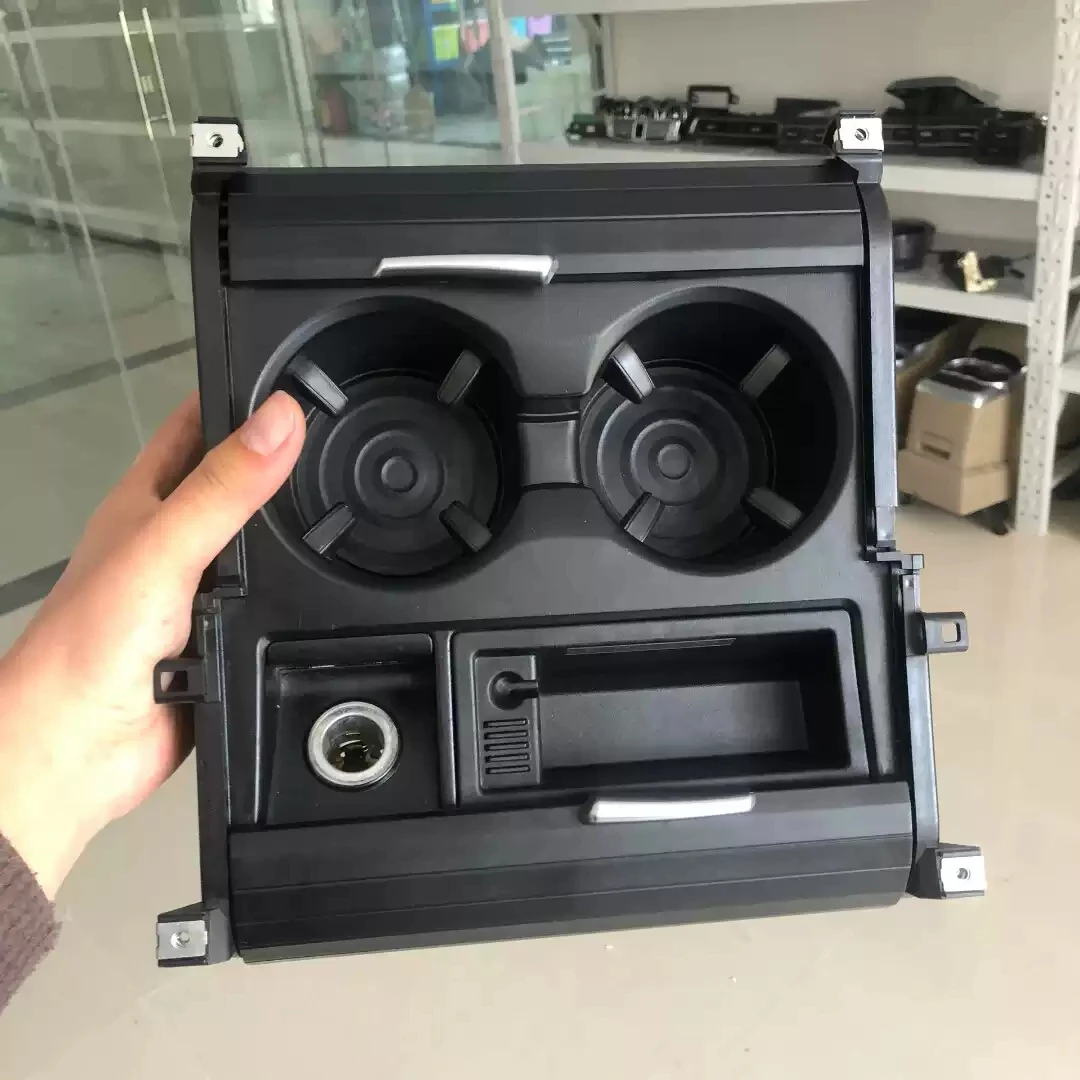 https://ae01.alicdn.com/kf/S851537ee594d4c468e3e4cbb2ec25280W/New-Double-Hole-Car-styling-Front-Center-Console-Storage-Box-Water-Cup-Holder-For-BMW-X5.jpg