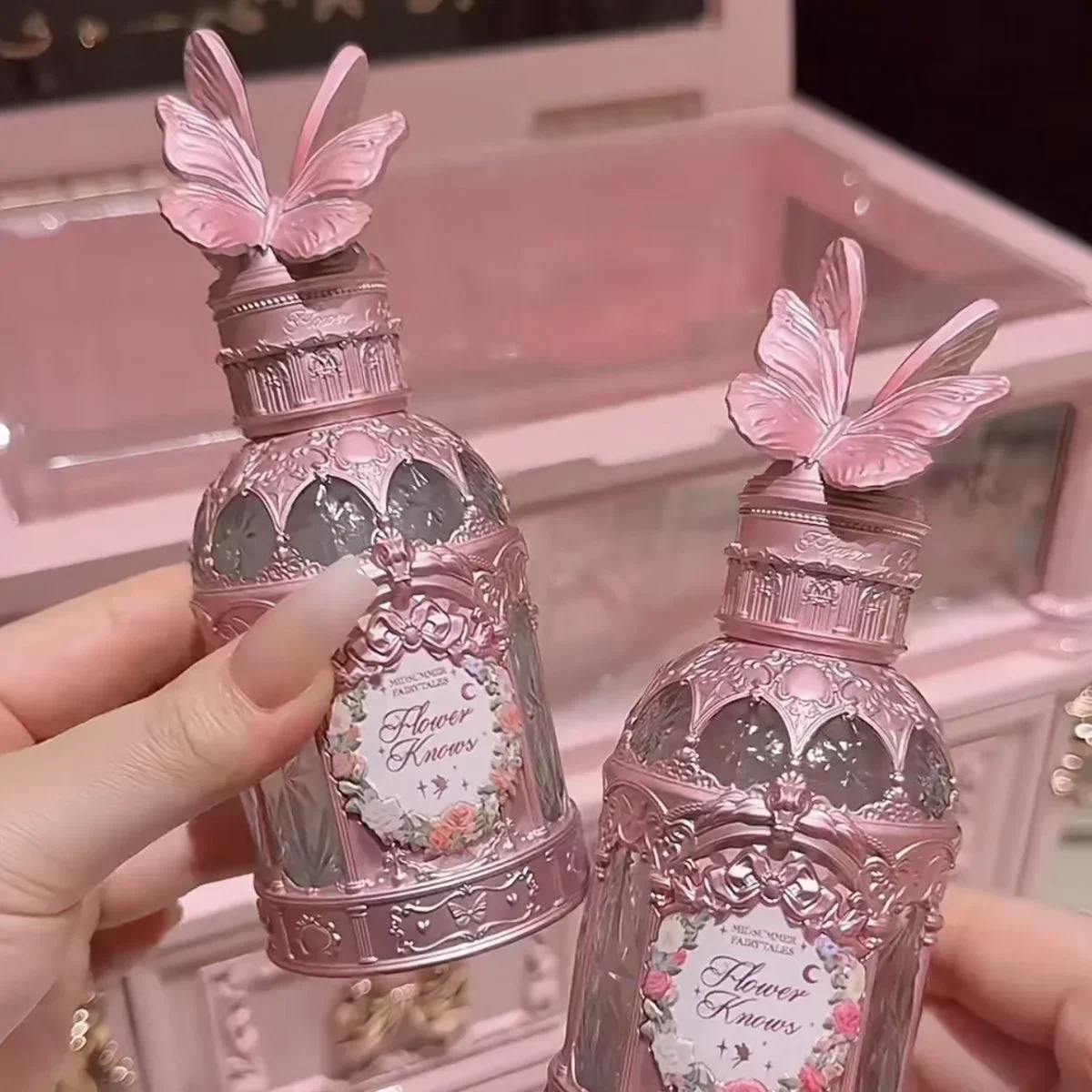 Flower Knows Perfume With Swan On Bottle Inhand Flower Knows