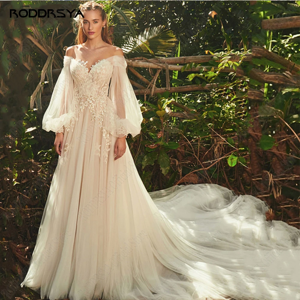 RODRSYA Light Champagne Vestidos de Noiva Pastrol Puff Mangas Longas 3D FlorRODDRSYA Luz Champanhe Vestidos De Casamento Pastrol Puff Mangas Compridas 3D Flores Vestidos De Noiva A Linha Sexy Backless vestidos de novia