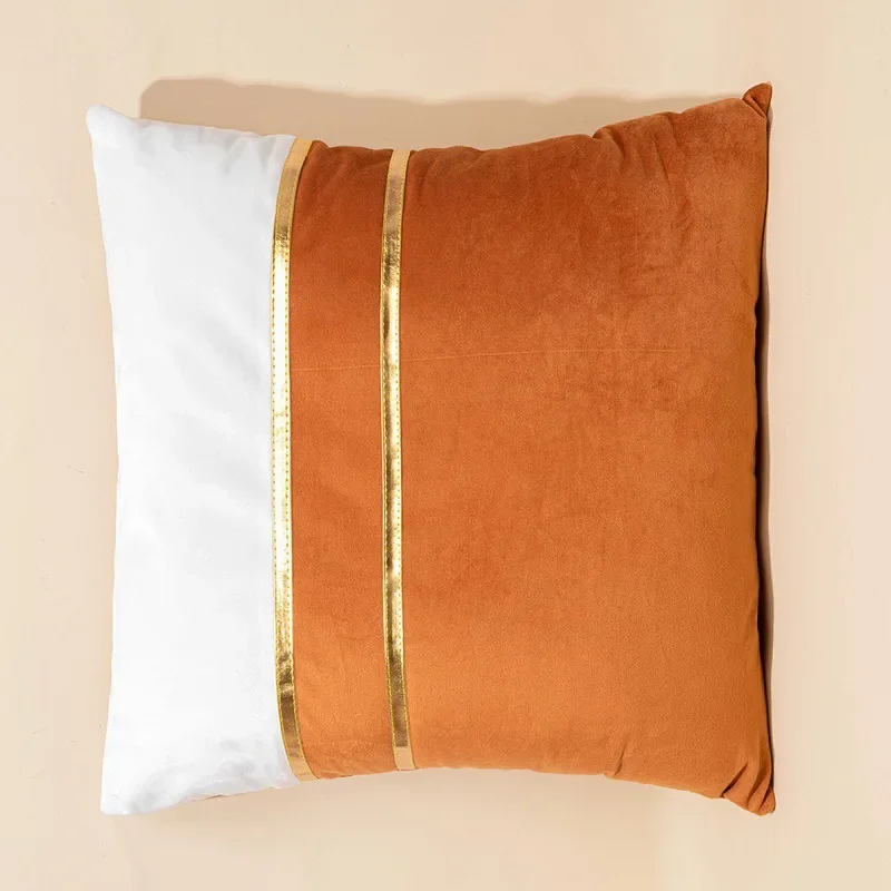Orange and white velvet pillow cover with gold-tone stripes