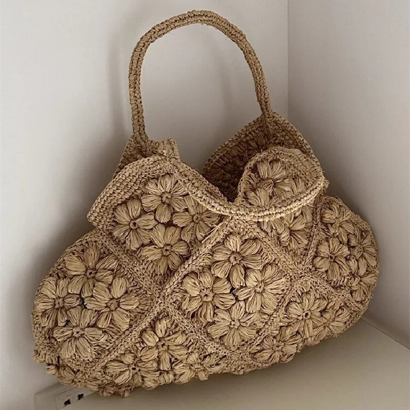 New French Handmade Lafite Grass Hollowed Out Woven Flower Petal Pattern Portable Women's Bag Seaside Vacation Fashion Bag Trend