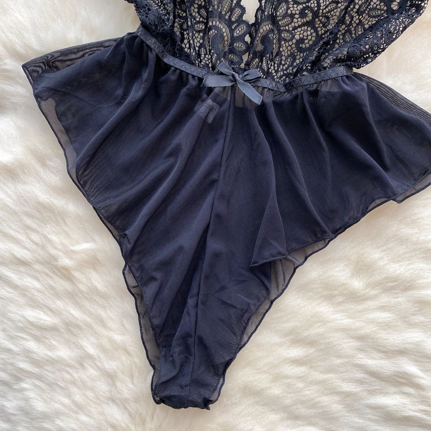 deep neckline detail with bow accent