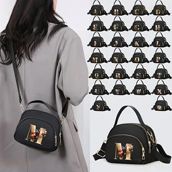 Una borsa a tracolla da donna alla moda con un bellissimo motivo floreale, 26 lettere, più scomparti e un ampio spazio interno.