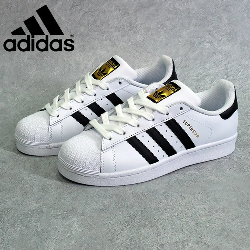 couple shoes adidas white