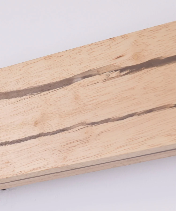 Close-up of the Rectangle Wood Wall Light, showcasing nature-inspired elements with visible dark grain lines running horizontally across a light wood surface, capturing a serene wooden aesthetic.