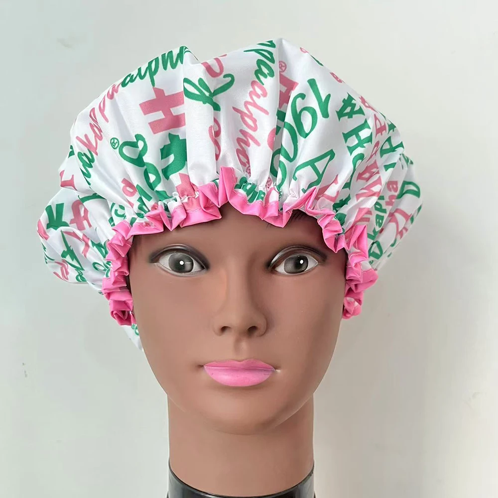 Alpha pink and white shower cap features organization name and feminine Greek letters. 2