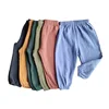 Детские летние свободные брюки, однотонные дышащие брюки в Корейском стиле для мальчиков, шаровары для девочек, простые детские широкие брюки 1