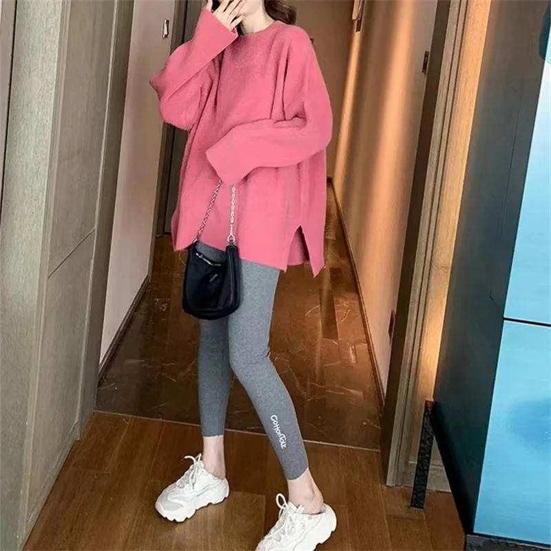 

Fall/winter lazy pullover sweater top women covered belly slim casual split sweater.
