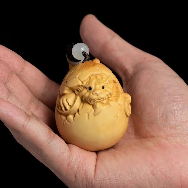 

Men's Boxwood Pendant Featuring Zodiac Dragon Design: Hand-Crafted Wood Carving Dragon Egg Inspired Accessory for Car Decoration