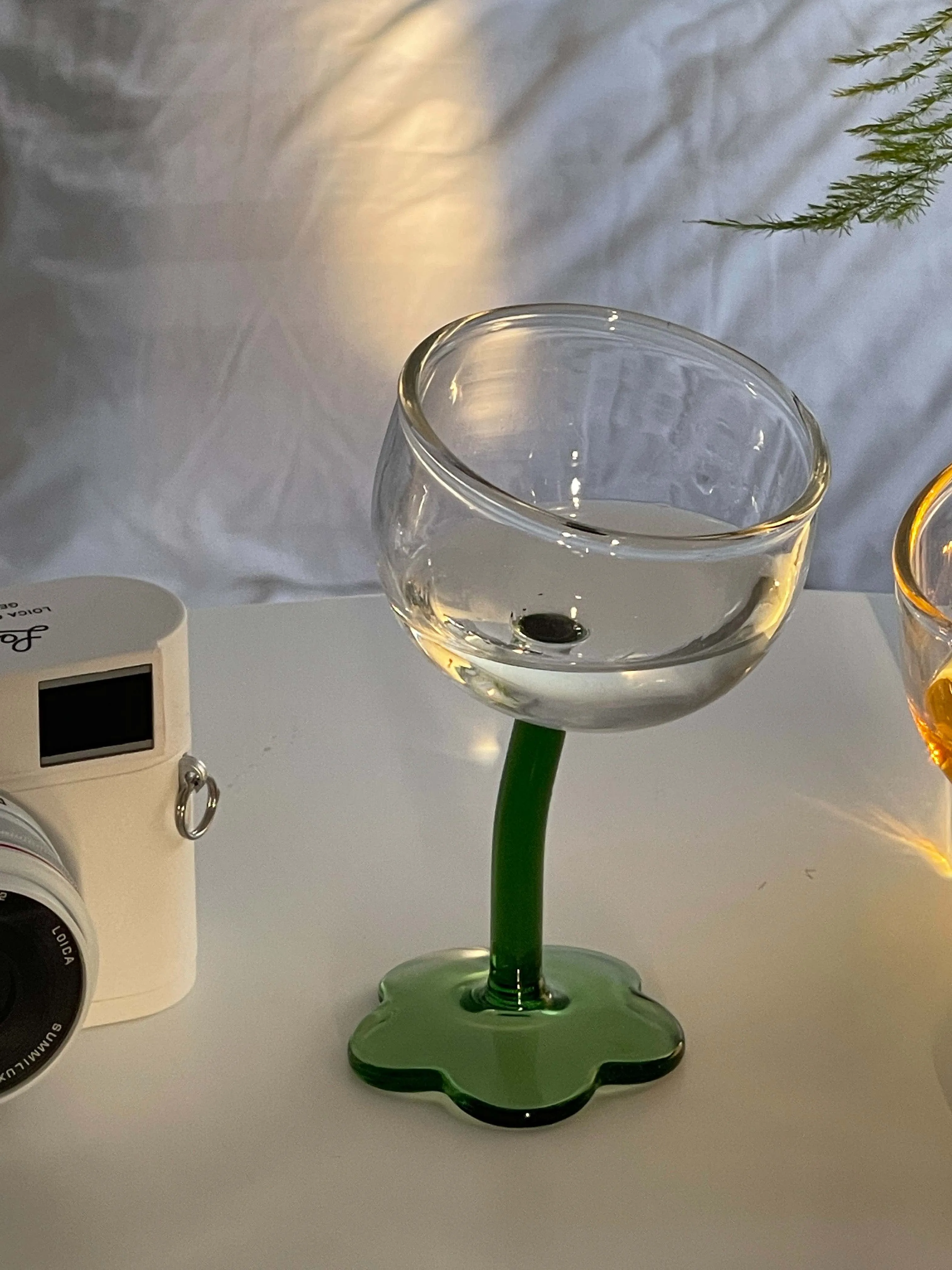 https://ae01.alicdn.com/kf/S87488cb14ee64236bf1920c5ecb150e5p/Homemade-Vintage-Wine-Cup-Lovely-Flower-Water-Cup-Crooked-Handle-Glass-High-Foot-Glass-Creative-Champagne.jpg