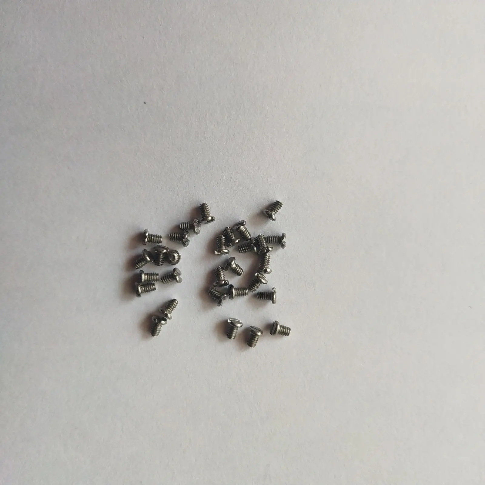 

100 Pcs saxophone spring plate screw Sax maintenance screw accessories