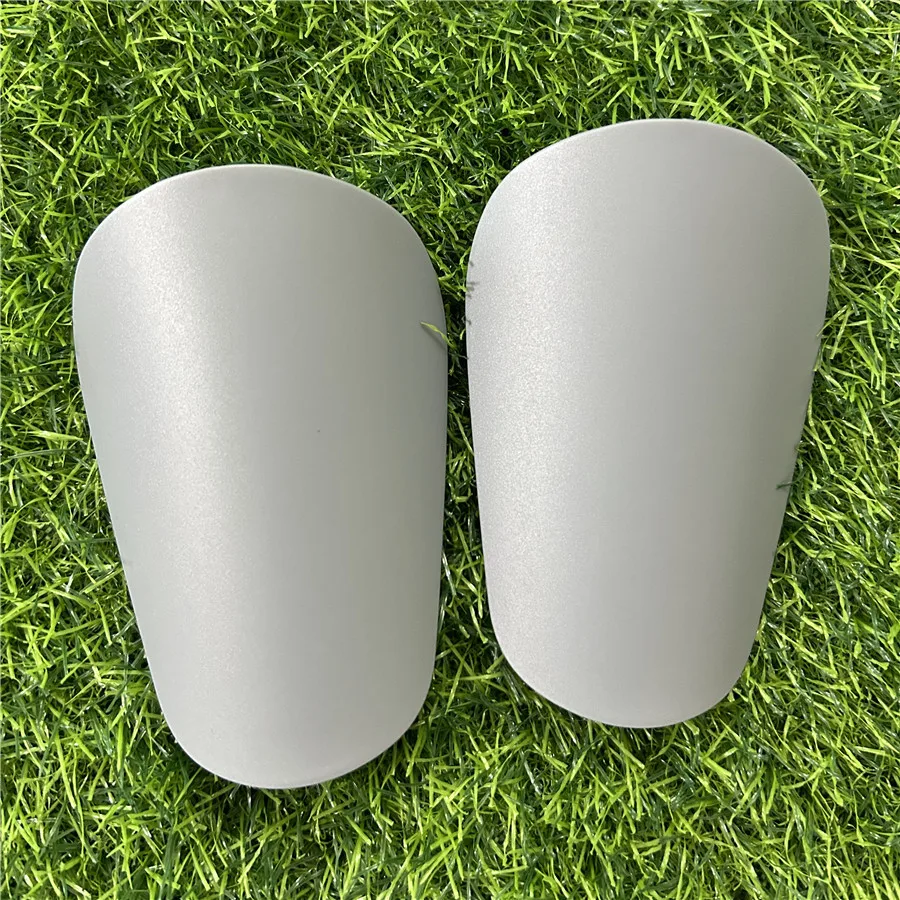 thumbnail image 1 of 1 par de mini espinilleras de fútbol resistentes al desgaste, protectores de piernas que absorben los golpes, livianos y portátiles, para entrenamiento de fútbol, 1 of 5