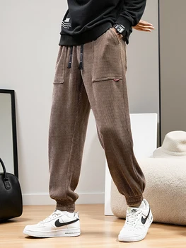 2025 Autunno Nuovi Pantaloni sportivi in velluto a coste a righe da uomo Pantaloni larghi affusolati elasticizzati Pantaloni sportivi in maglia vestibilità ampia 1