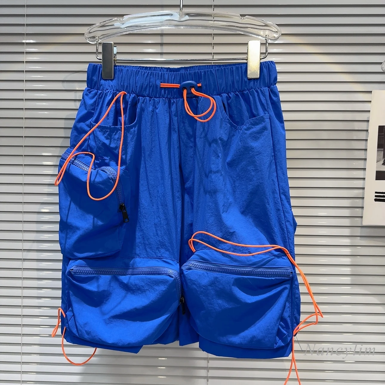 shorts-bleus-de-style-fille-chaude-pour-femmes-et-hommes-conception-de-sangle-de-wstring-de-proximite-poche-cargo-short-de-rue-nouveau-ete-2024