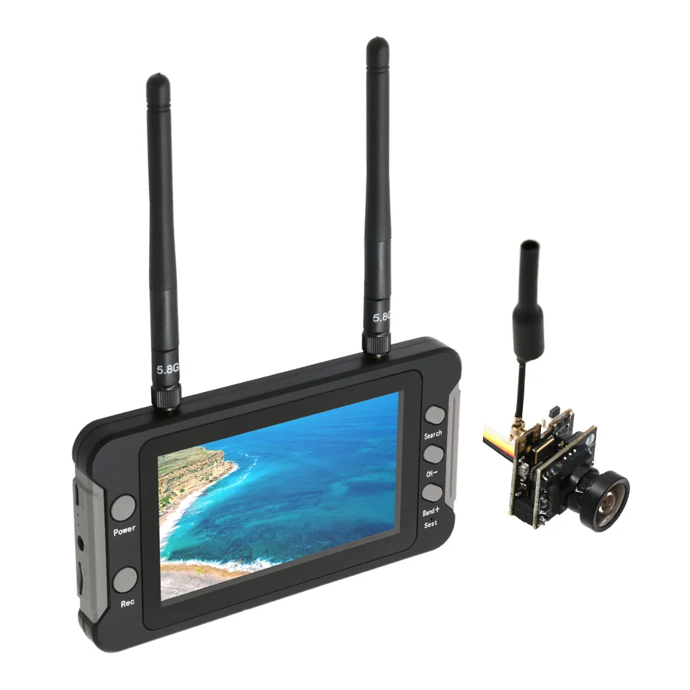Moniteur FPV 5.8G 3 pouces 40 canaux posé sur une table, avec antenne et câble AV connectés