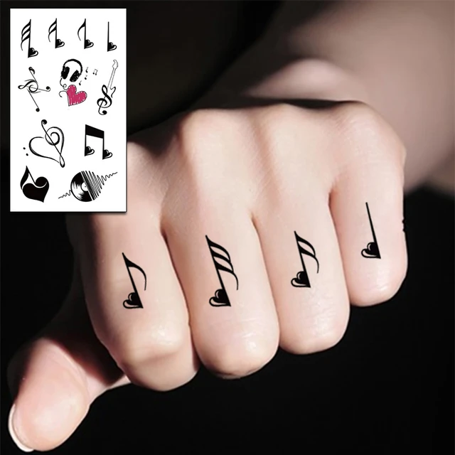 Music symbols tattoo on fingers