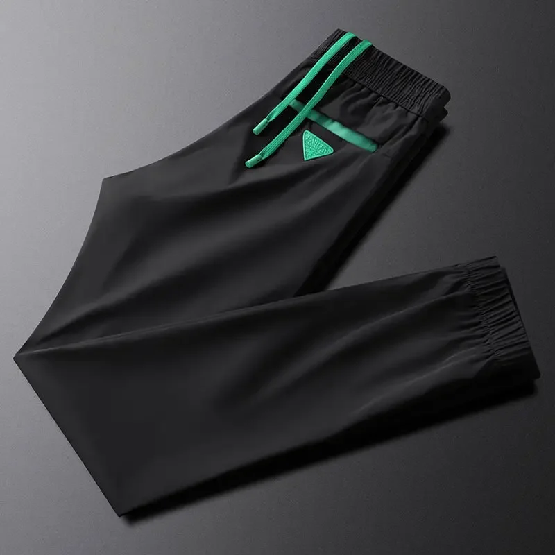 2024 Summer Ice Silk Breathable White Casual Pants for Men's Designers New European High end Fashion Casual Brand Sports Pants