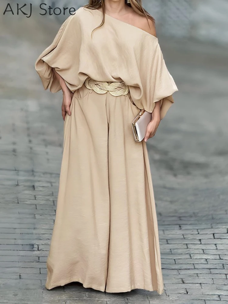 

Женский топ с косым воротником и рукавами-фонариками и брюки с широкими штанинами без пояса