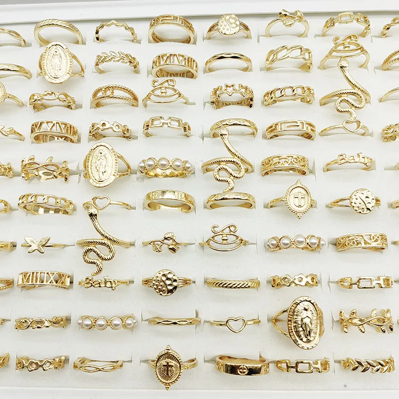 Collection of gold colored rings showing snake and animal motifs