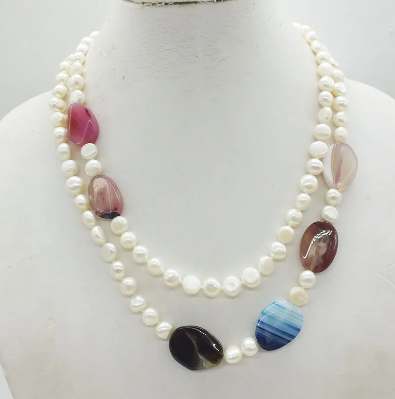 

The most beautiful necklace for ladies. 8MM natural white Baroque pearls and Brazilian semi-precious stones. Classic necklace