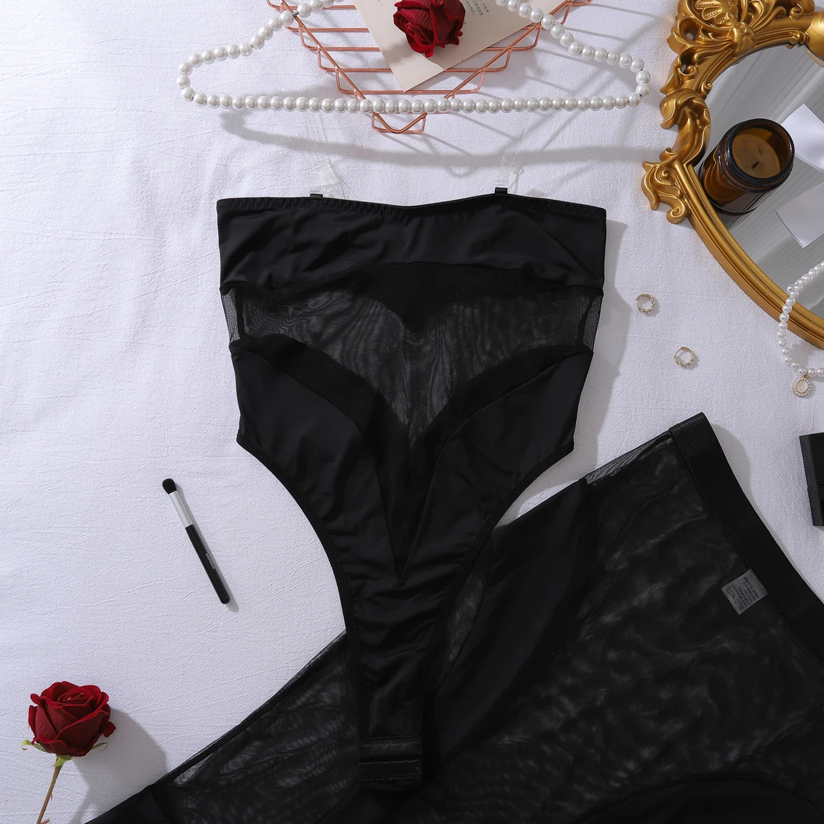 Mesh dress detail with bold contrast panels and sleek statement lingerie finish
