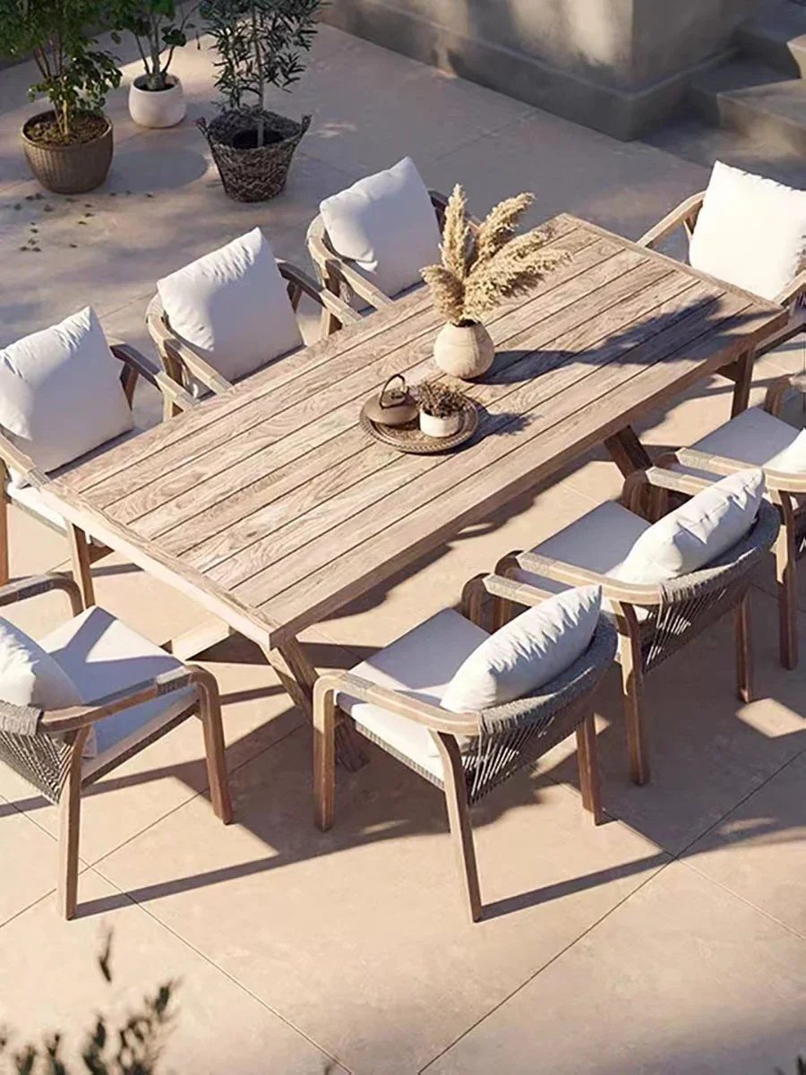 Outdoor terrace, teak sofa, rattan woven tables and chairs