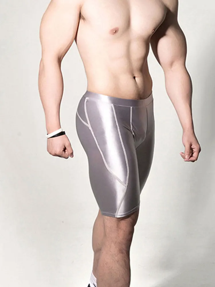 

Sexy Men Oil Shiny Fitness Shorts Quick Dry Elastic Short Pants Swimming Surfing Trunks Shiny Plastic Breathable Pants Gay Wear