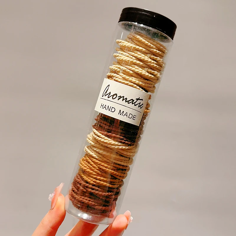 100 milk-colored hair ties (one can)