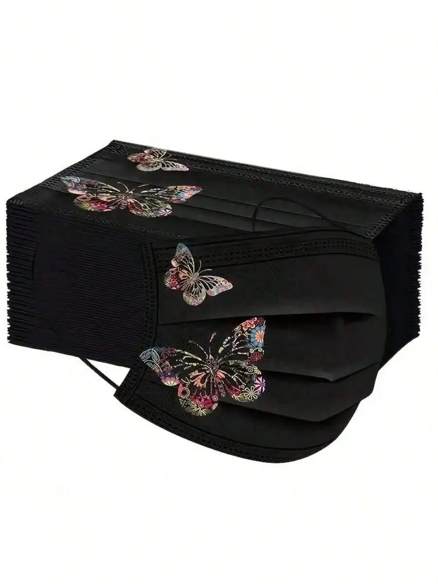 Masque réutilisable en tissu motif papillon jaune et orange, vue détaillée du tissu et des attaches élastiques.