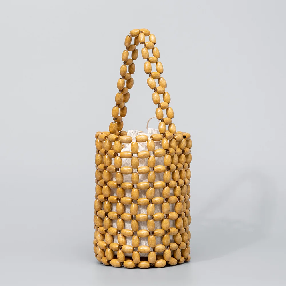 

Handwoven bag niche design bucket bag, European and American high-end wooden bead bag, women's crossbody bag