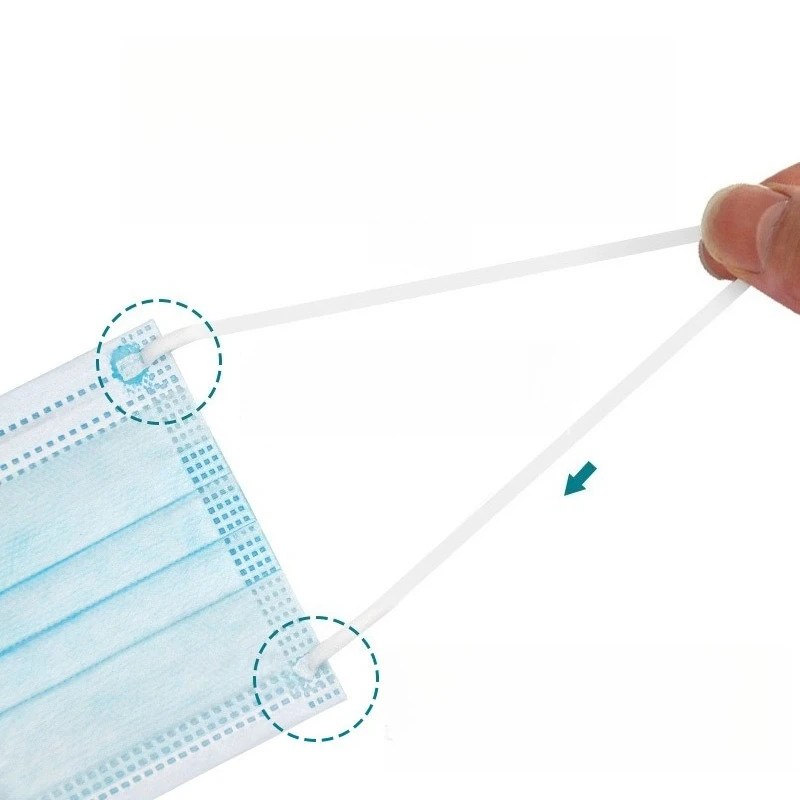 Masque individuel déplié montrant la couche de charbon actif, lot de 50 pour protection anti-poussière.