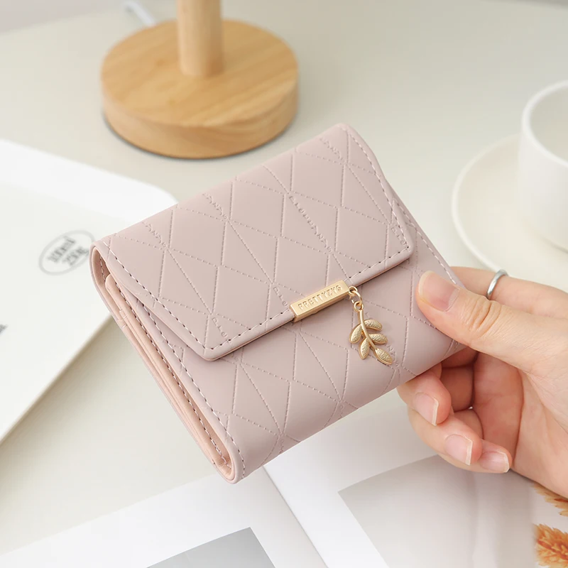 Autumn and winter new women's short wallet Japan and South Korea small fresh simple PU folding device straw necklace three-fold