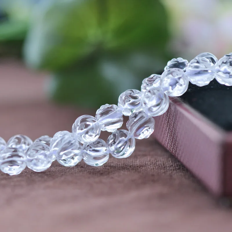 

Joanlyn Grade AAA Natural Clear Quartz Beads Round with Rose Carved 8mm-14mm 15 Inch Strand CQ31