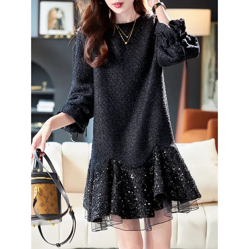 Woman wearing a black mesh sequin splicing dress with slim silk midi skirt in elegant evening style black 02