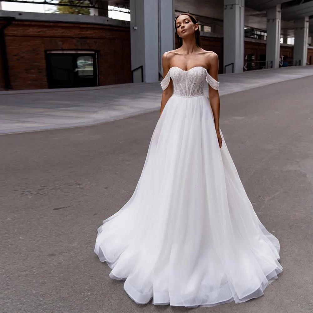 

Elegant Tulle A-line Wedding Dresses Off the Shoulder Luxury Robe Mariage Beading Pearls Glitter Vestidos De Novia Bridal Gowns