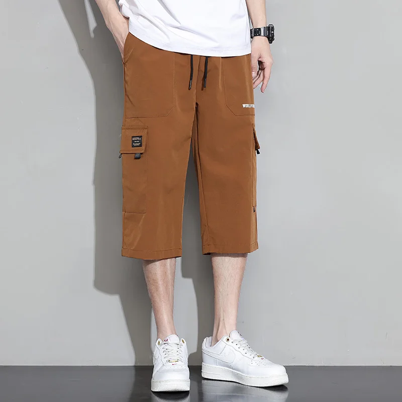 Summer New Solid Color Fashion Elastic Waist Wide Leg Trousers Man High Street Pockets Drawstring Ventilate Calf-Length Pants
