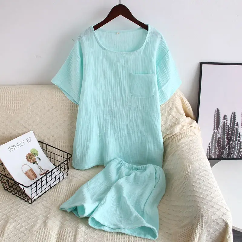 

2023 Summer Round Neck Pullover Tops with Pocket Solid Color Short Sleeved Shorts Pajamas Women's Cotton Home Clothing Set