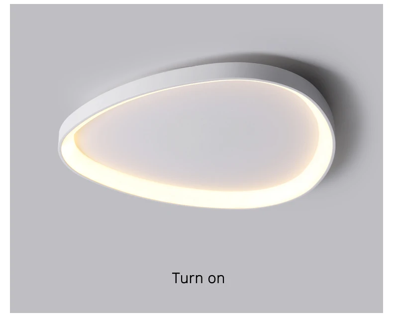 The Nordic Minimalist Ceiling Light features an oval design, emits a soft glow, and offers dimmable brightness and adjustable color temperature for ideal ambiance.