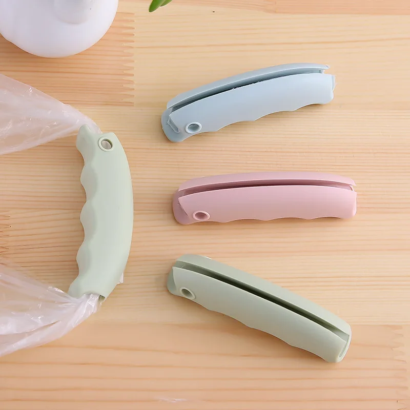 Silicone anti pinch hand effortless vegetable picker plastic bag handle