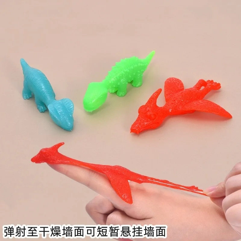 Finger Ejection Dinosaur Toys Rubber Dinosaur Slingshot Boys Stress Relief Toys Kids Decompression Gift Toy Party Favors 5/10Pcs stress relief toys finger dinosaur toys