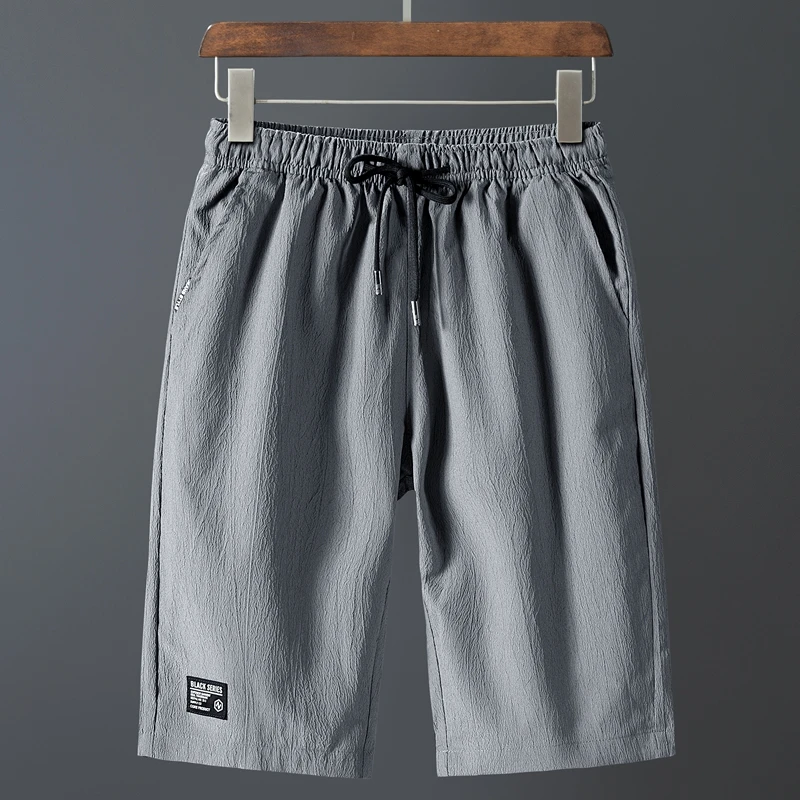 

Summer Men's Shorts Casual Fashion Solid Color Drawstring Sports Fitness pants Loose Breathable Quick Drying Basketball pants