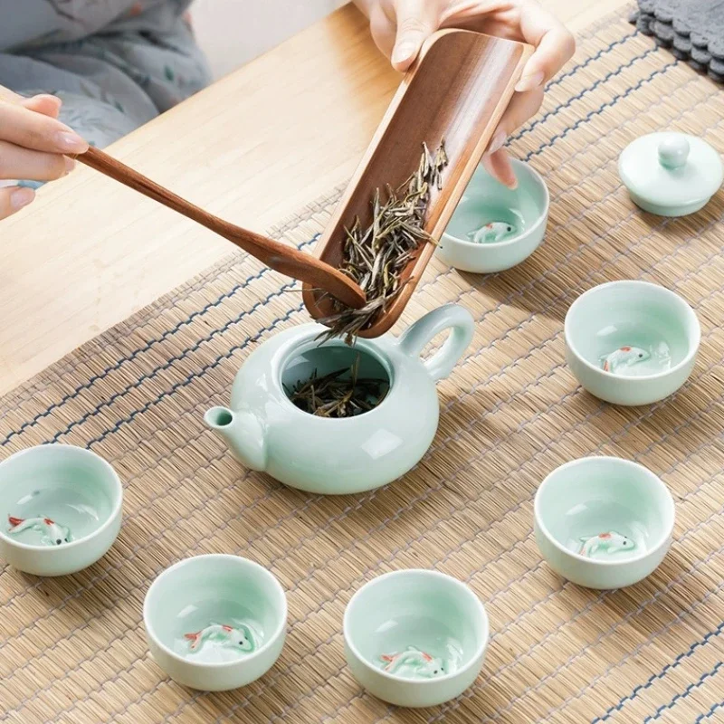 Description Picture 5 of item7/9PCS tea set , 9pc kung fu tea set: 1 teapot and 4 Koi tea cup, 1 tea wood tray, 1 tea travel bag, 1 tea tray, 1 clean cloth