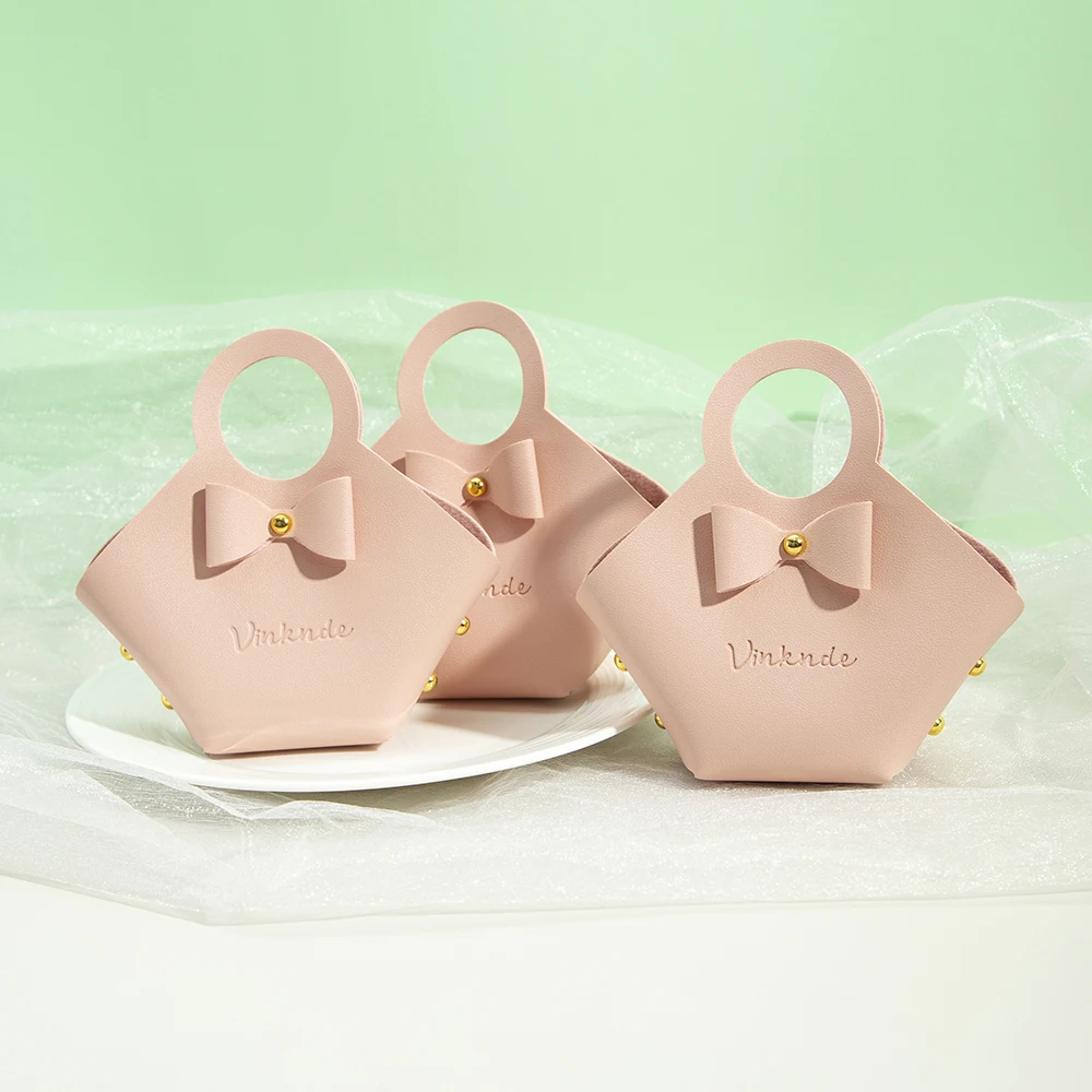 20 50 100pcs pink pu leather jewelry bag 16x9x7cm wedding candy chocolate handbag with bowknot baby shower storage basket pouch 20/50/100Pcs Pink PU Leather Jewelry Bag 16x9x7cm Wedding Candy Chocolate Handbag with Bowknot Baby Shower Storage Basket Pouch